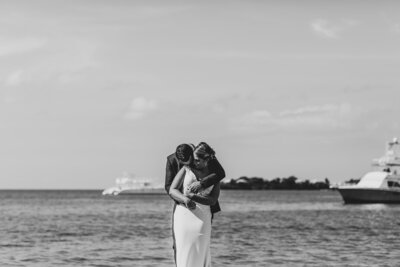 man kissing woman on cheek