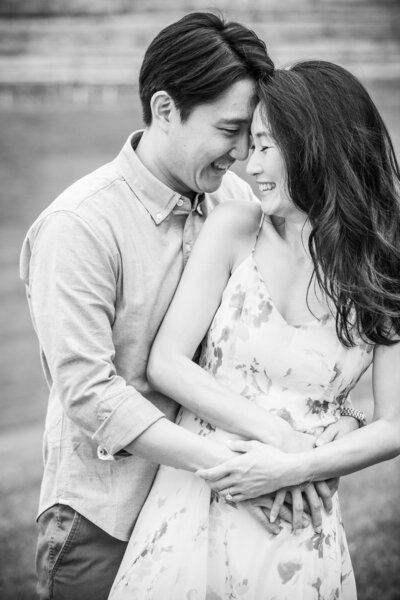 Couple hugging during their springtime engagement session at Montaluce Winery