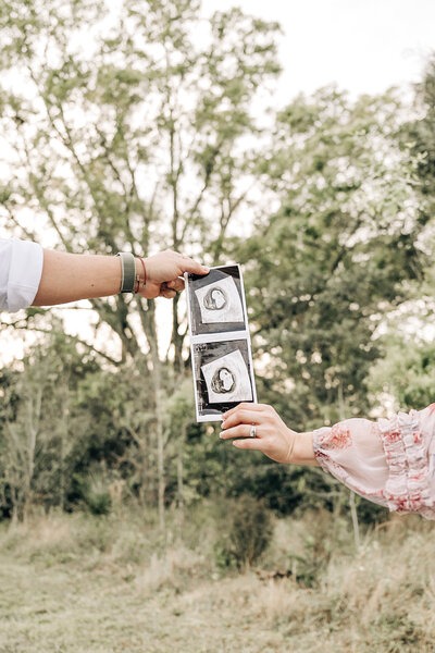 South Florida Maternity Photographer captures couple holding on to their ultrasound