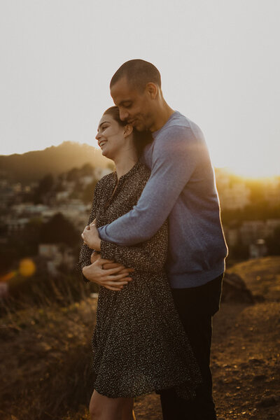 couple embracing on mountain