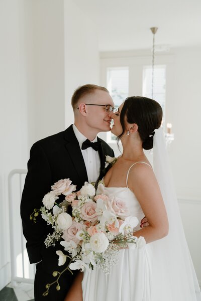 Bride and groom sharing a joyful moment during their bridal portraits