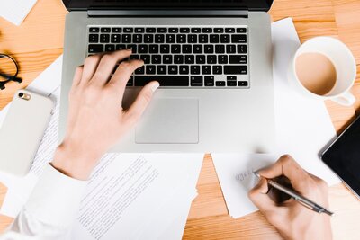 top-view-workspace-with-laptop-coffee_23-2148205584