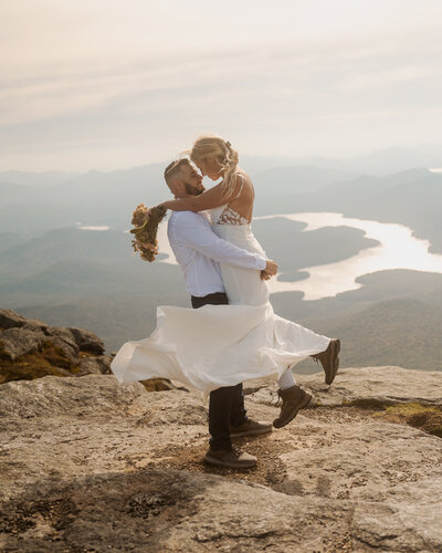 A celebratory embrace after their Lake Placid elopement on Whiteface Mountain.