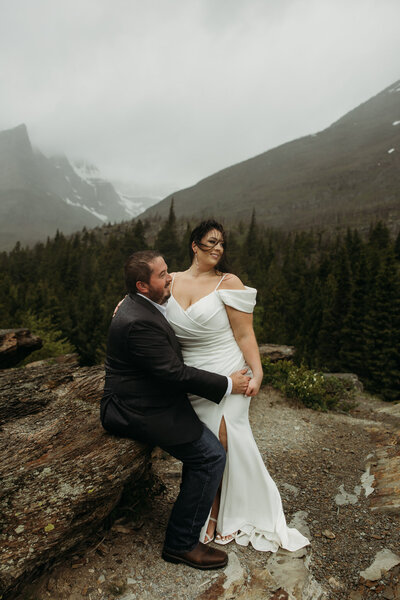 glacier national park elopement couple posing in front of mountain views