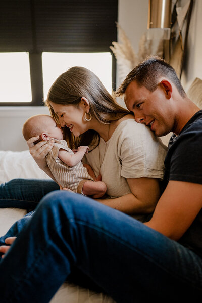New parents look at their baby in their home in Northern Colorado