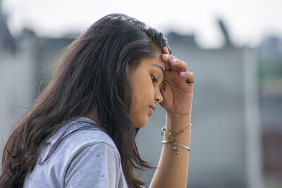 Depressed teen girl in Therapy for Depression in Denver. 