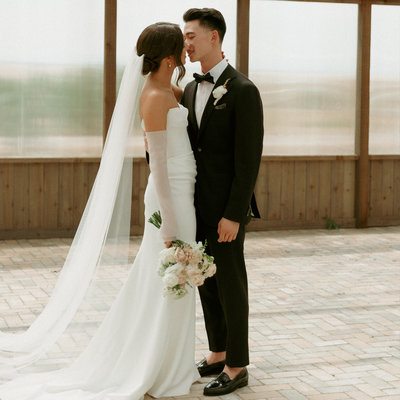 The bride and groom looking at each other so in love on their modern wedding day at Bonnie Blues in Colorado.