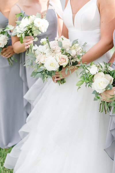 Bridesmaids and bride holding bouquets