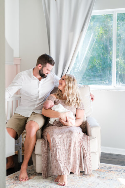 Dad tickles son during Saturday morning photo session