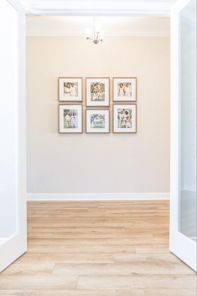 Framed portrait gallery wall in Savannah home taken by savannah portrait photographer​ Tiffany Bradley