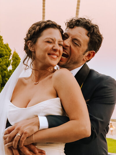san diego bride and groom smiling at photo