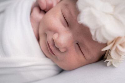 Seattle Newborn Photographer captures first smiles in clients home in Lynnwood.