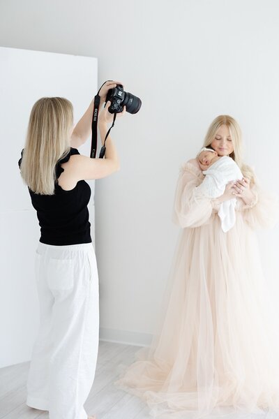 a woman getting her makeup done during a portrait session