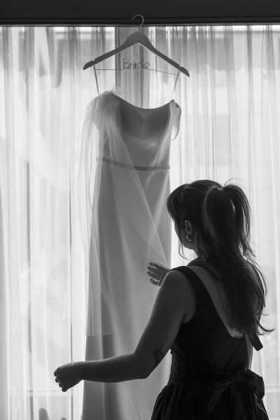 photographer with wedding dress
