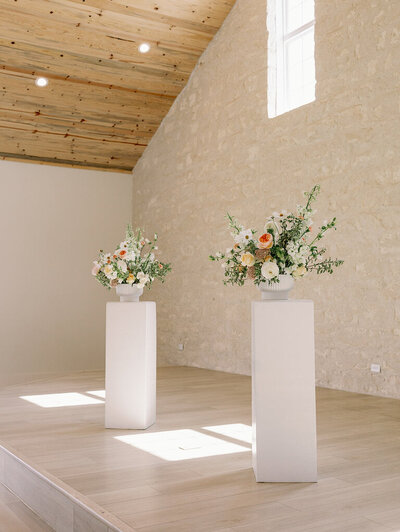 Two large luxurious flower arrangements decorate a Texas venue.