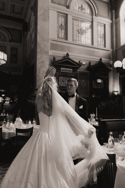 bride and groom admiring eachother in a church