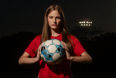 a senior soccer player during her senior photo session in chattanooga