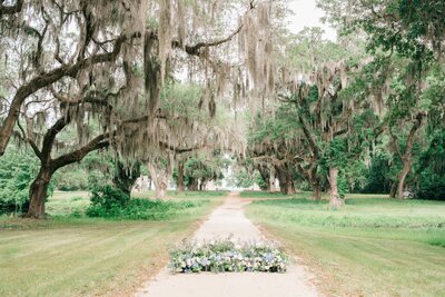 Ceremony florals amongst beautiful trees