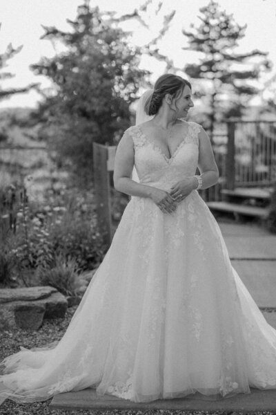Bride looking at husband with wedding photographer in Ottawa