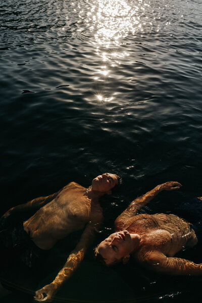 lgbtq+ couple engagement session on Lake Coeur d'alene in the summer