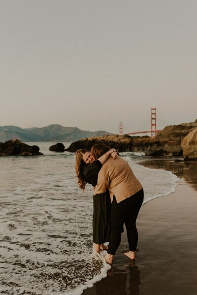 Couple embracing on a beach in San Francisco