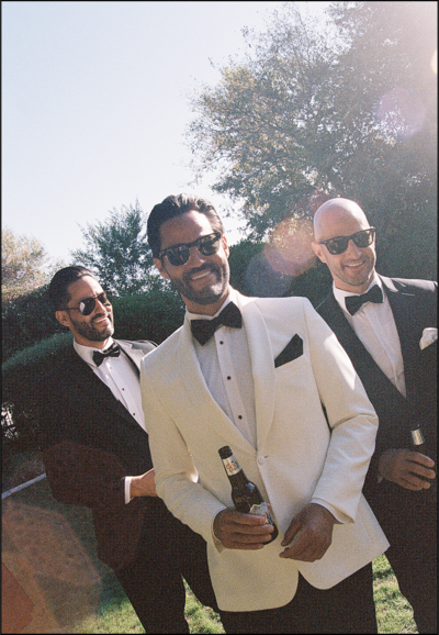 film wedding photography groomsmen smiling and laughing