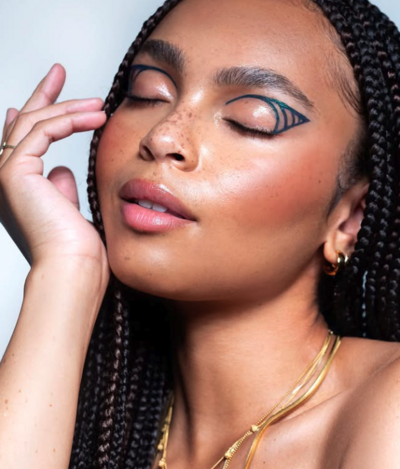 Editorial beauty look with graphic liner and clean skin