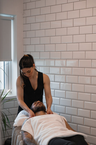 man receiving facial treatment 