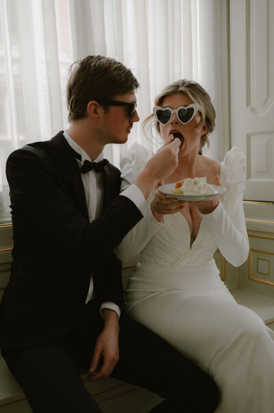 Couple Eating Luxury Wedding Cake