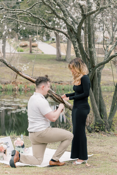 Couple sitting on the steps of the PA State Capitol in Harrisburg during their engagement session