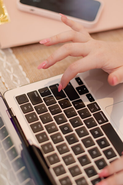 Woman typing on laptop