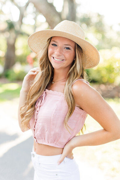 Portrait of a college senior with a hat