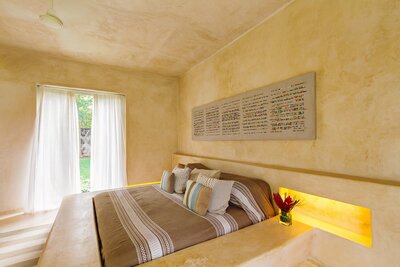 bedroom of a luxury yoga and pilates retreat in Mexico