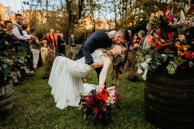 newlyweds posing for their wedding day portraits in a book case reflection at the historic Bleak House in Knoxville, TN