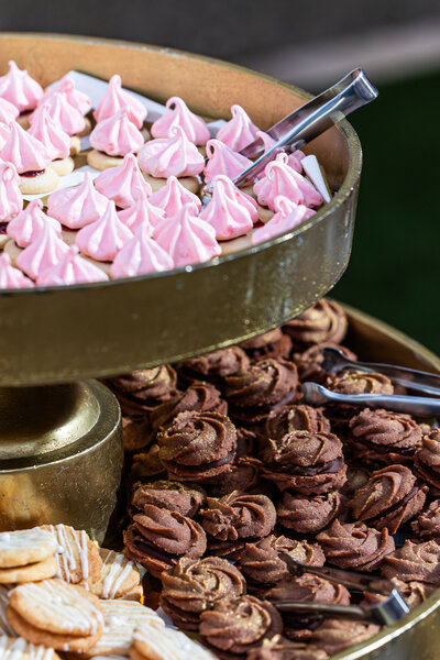 Dessert bar cookie display with pink meringue kisses, chocolate ganache swirls, lemon cookies