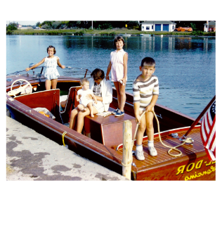 Young children playing on vintage boat