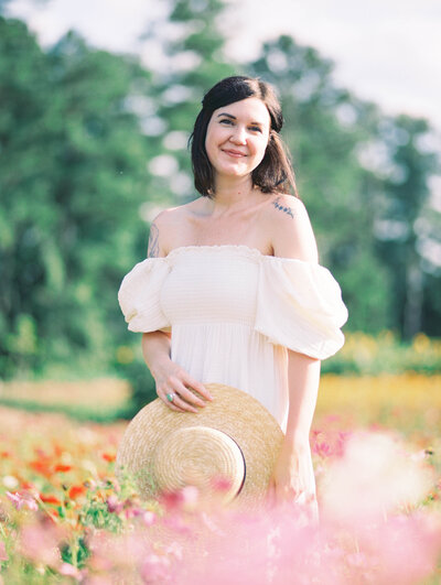 Adrianne Shelton in a Nothing Fits But dress in a field of flowers Richmond family photographer