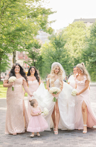 bride and bridesmaids portraits in front of marie reine du monde church | luxury wedding in montreal