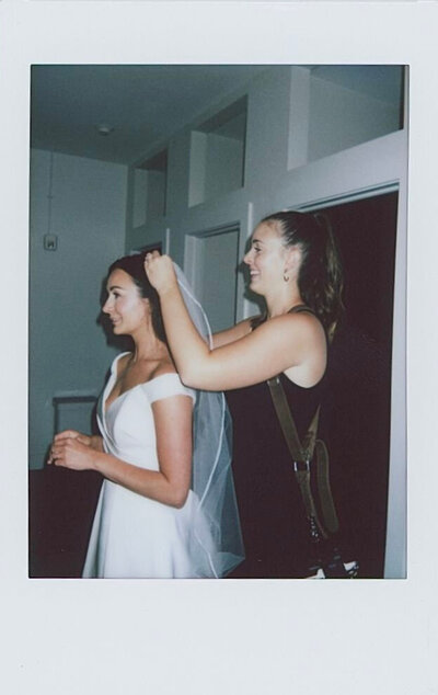 Ceci fixing a bride's hair