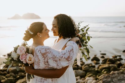 black and white image bride and groom  kissing