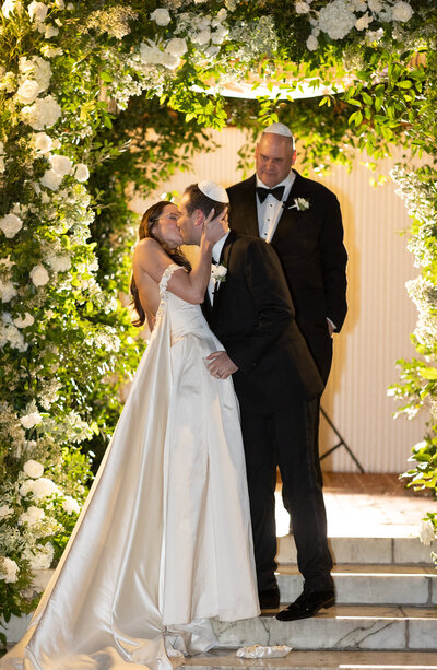 Bride and Groom kiss at wedding ceremony at the Museum of The City of NY