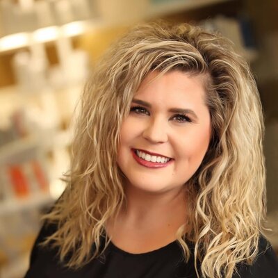 Portrait of Danielle Foster, co-owner and stylist at Tailored + Co, known for expert color and personalized client care