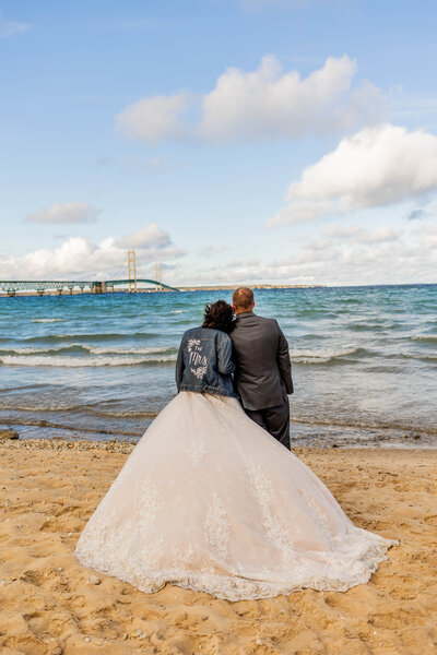 bride and groom by lake