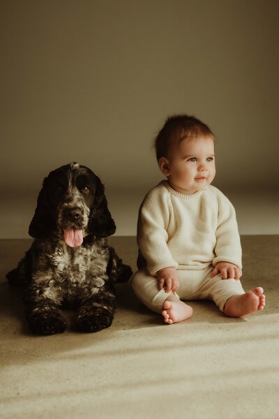 Children and dog posing together in studio, captured by Sydney family photographer Sophie Lea.