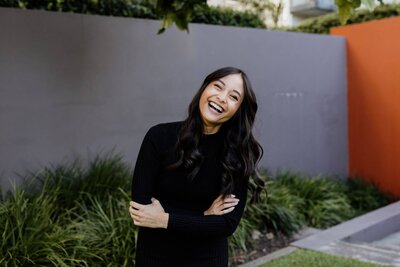 Trang, full of energy, laughs at the camera.