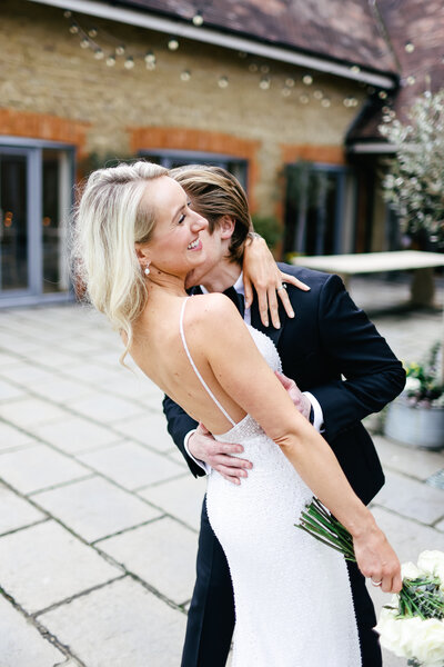 groom-holding-bride-at-luxury-destination-wedding-in-port-grimaud