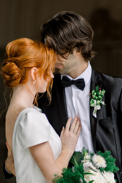 A heartfelt moment between a bride and groom, captured in intimate detail by Tiffany Longeway Photography. This image highlights the emotional connection and timeless beauty that define luxury weddings in California