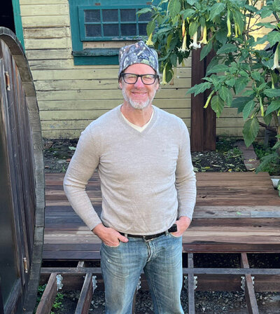 Readingbuilt founder Grant Reading standing in a yard mid-project