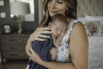 Newborn in bucket pose