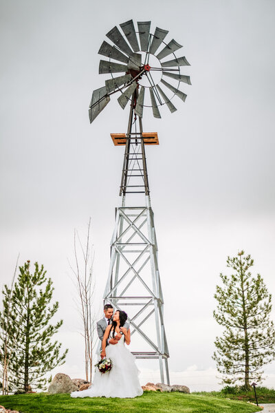 Ashley and Danny in front of a wind mill